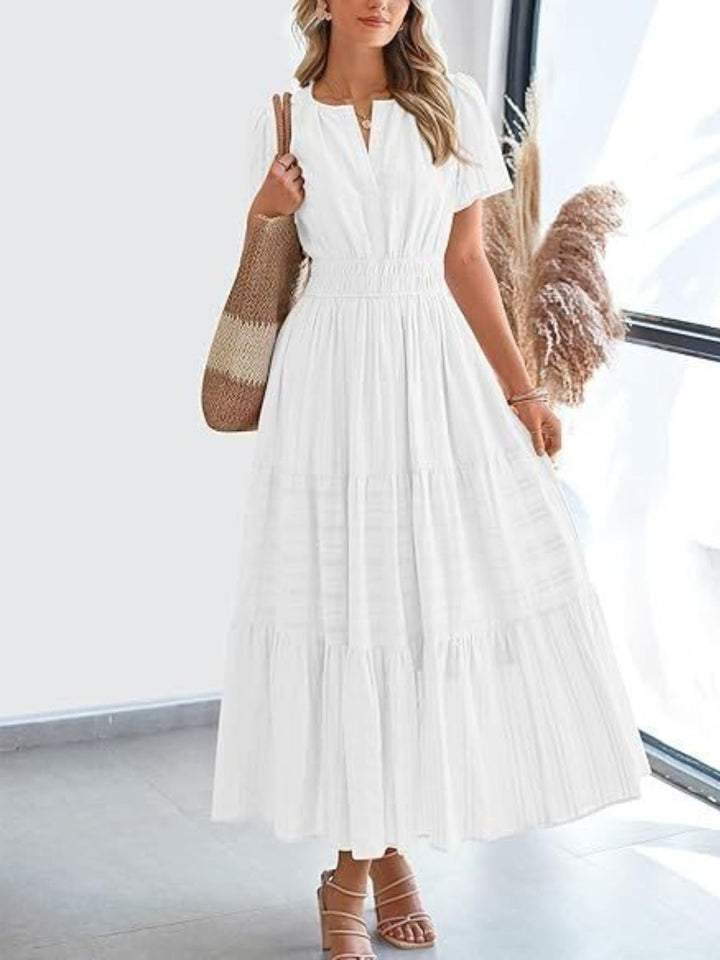Abi - Robe élégante coupe A-line à étages avec manches courtes et col échancré