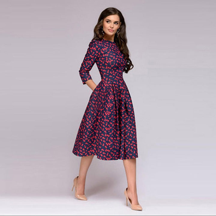 Rotie | Robe rouge à pois avec manches trois-quarts