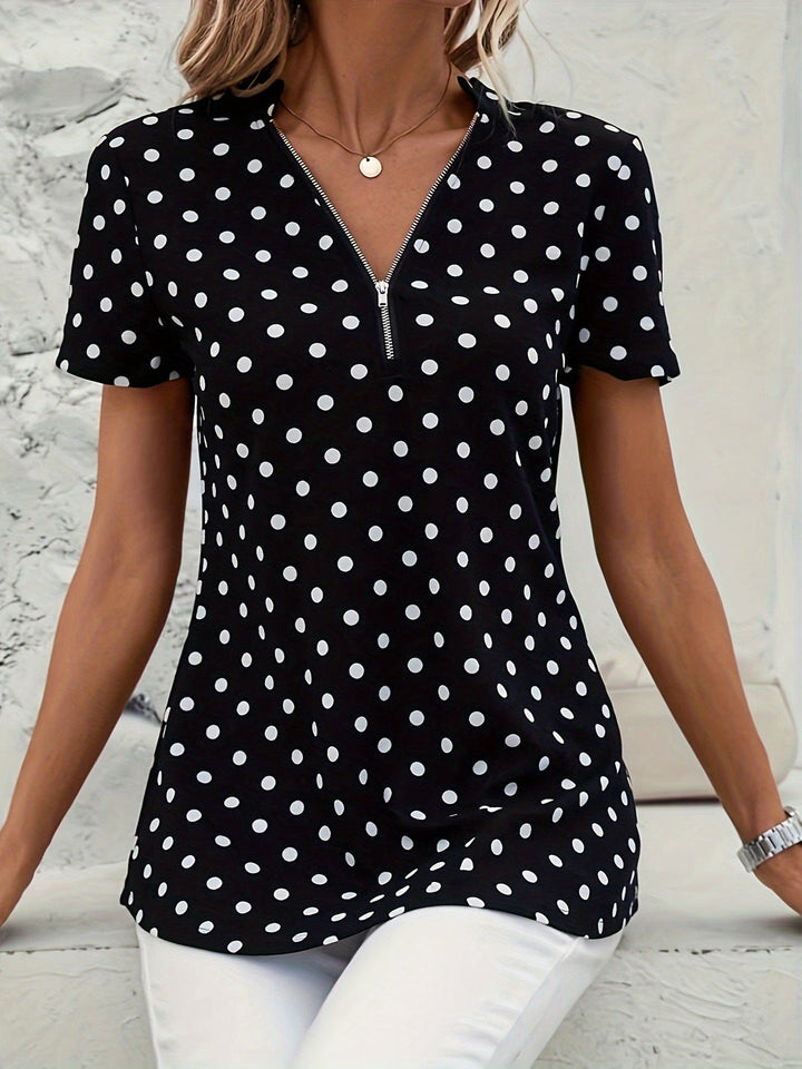 Uzziah - Blouse à pois avec col en V et fermeture zippée quart